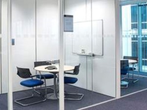 A full height glass partion used to create a small office space.